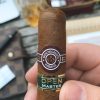 A person holding montecristo eagle open series cigar branding image